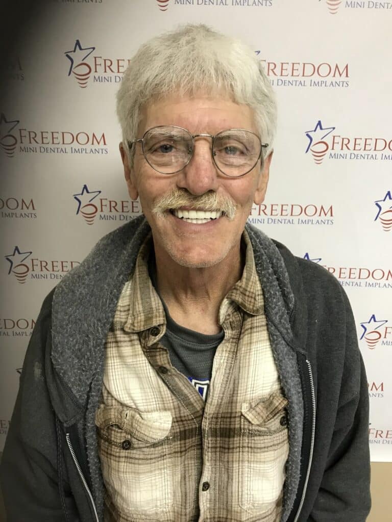 After-treatment smile photo from Freedom Dental Implants in Louisville