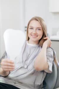 Patient reviewing mini dental implant process steps in Louisville