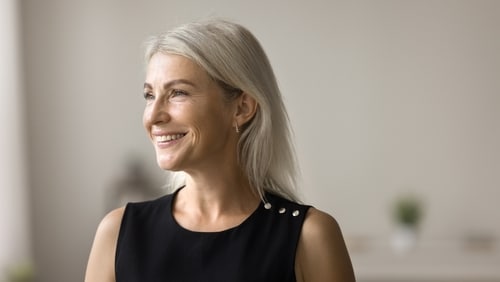 Patient smile after mini implants and dentures in Louisville