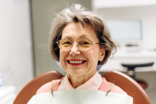 Patient smile after Freedom mini dental implants in Louisville