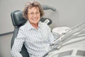Patient smile after dental implants in Louisville