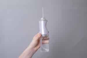Water flosser care for mini dental implants