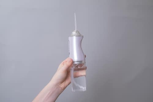 Water flosser care for mini dental implants