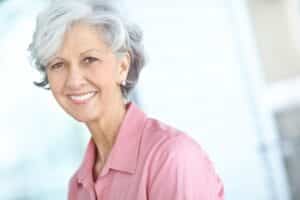 Patient smile after reviewing a second opinion implant plan in Louisville